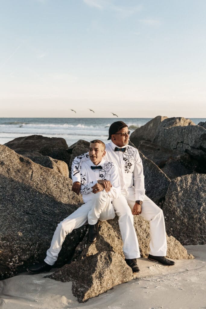 Couple who eloped in under 2 weeks sitting on rocks after saying vows